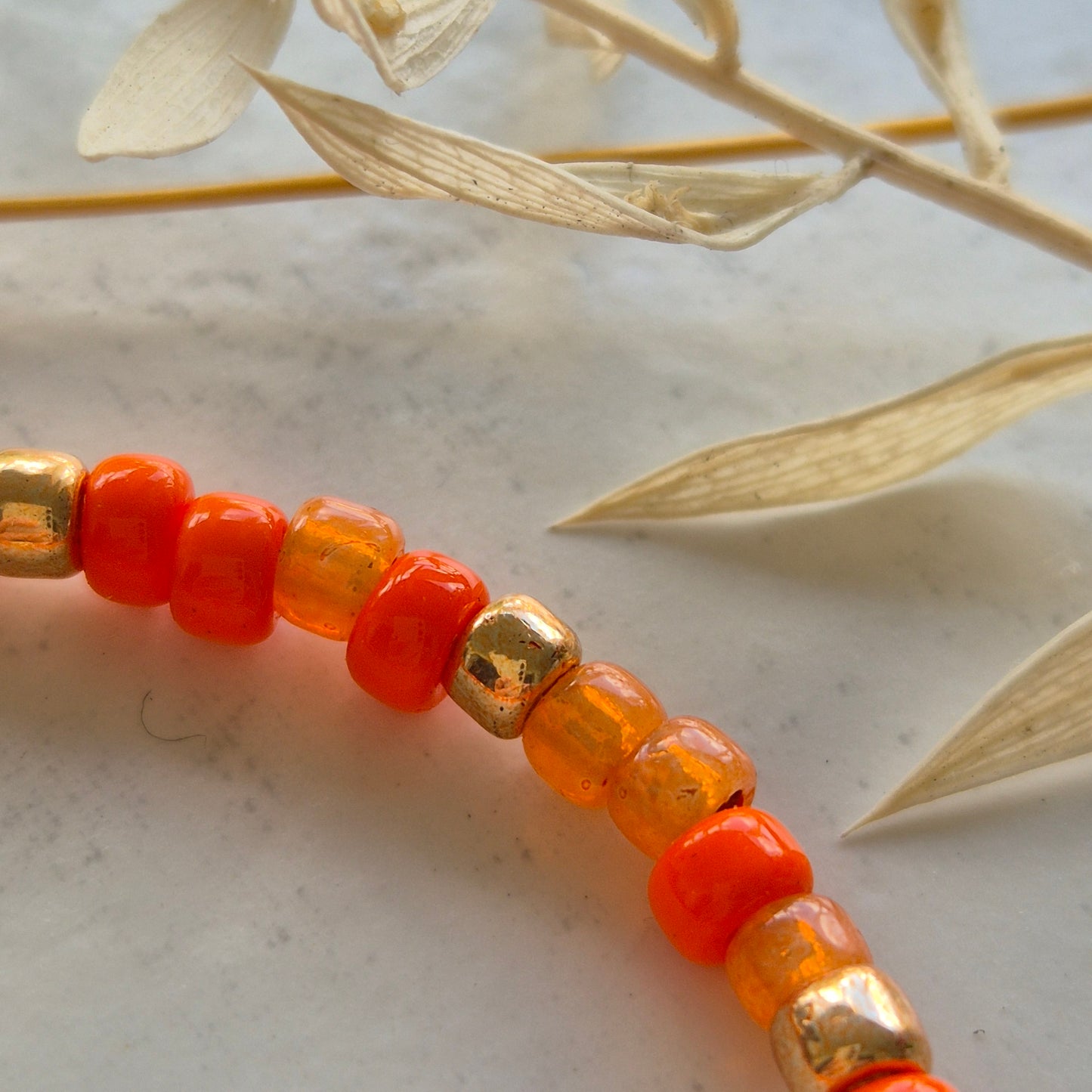 Handgemachte Armkette Orange Glasperlen